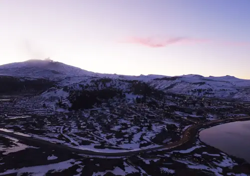 The town with the volcano in the background