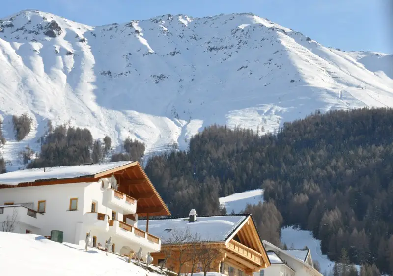 Fendels village overlooked by the Winterberg Fendels ski resort in Austria