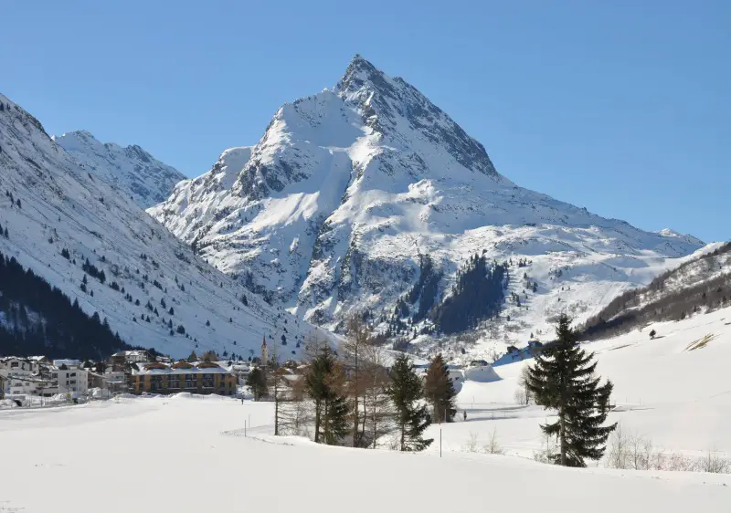 Ballunspitze (2,671m) rises over Galtür ski resort in the Paznaun Austria