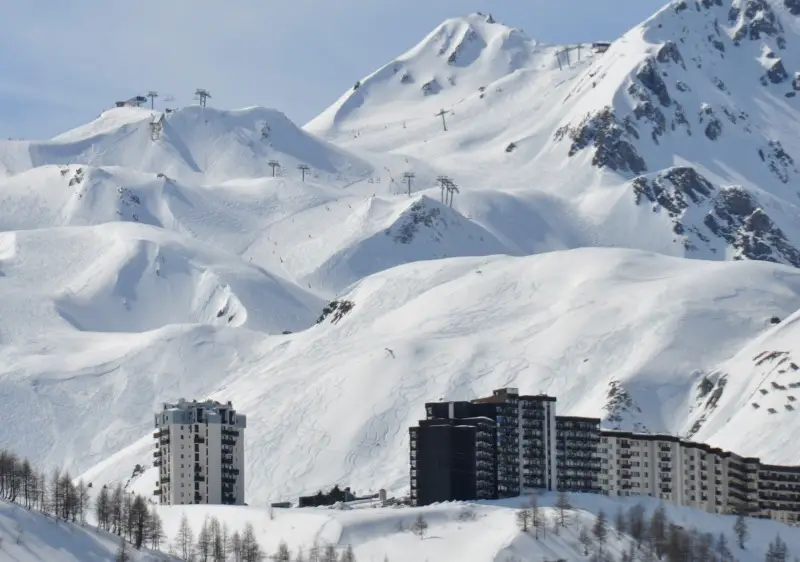 Tignes glorious alpine terrain toward Col du Palet rises above Lac Lavachet village