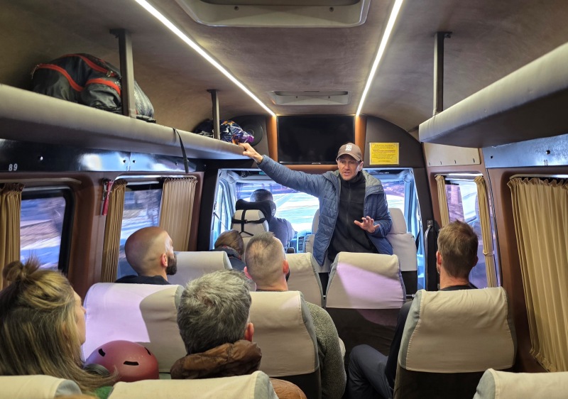 Tour & ski guide Vasily on the tour bus